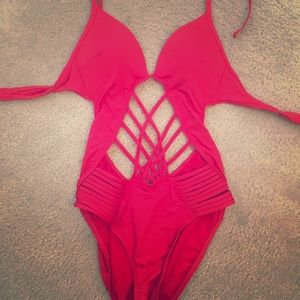 Red one piece swimsuit with cut outs